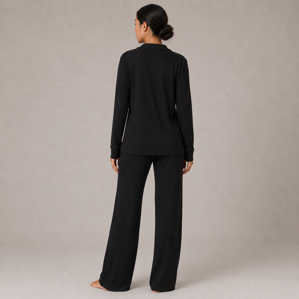 Back view of the FitFigura Soft LoungeWear Set – Comfort Form in Onyx Black, featuring a relaxed long-sleeve lounge top and matching wide-leg pants.