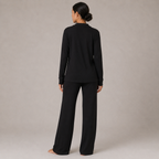 Back view of the FitFigura Soft LoungeWear Set – Comfort Form in Onyx Black, featuring a relaxed long-sleeve lounge top and matching wide-leg pants.