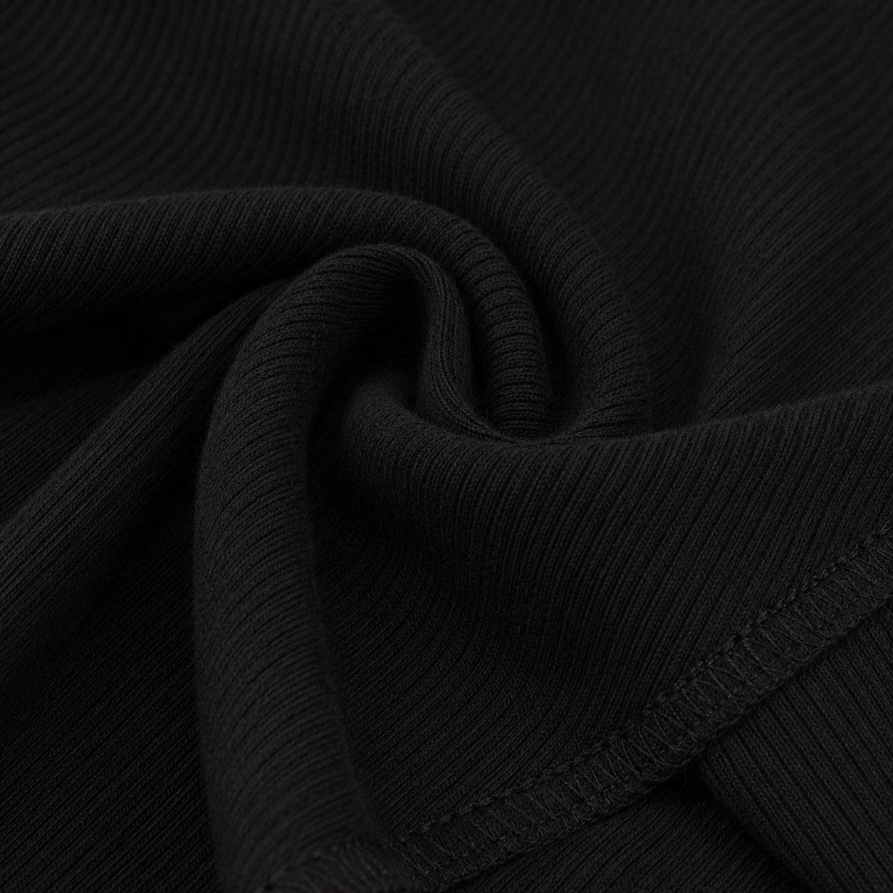 Close-up fabric detail of the FitFigura Soft LoungeWear Set – Comfort Form in Onyx Black, highlighting the soft ribbed texture.