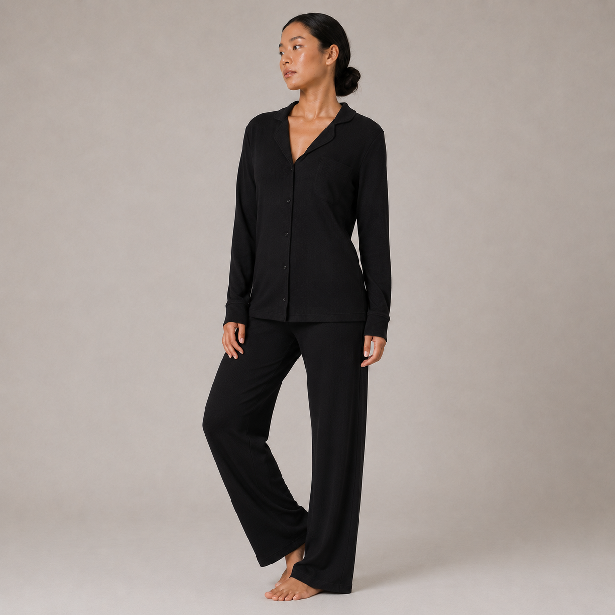 FitFigura Soft LoungeWear Set – Comfort Form in Onyx Black, shown in a three-quarter view with a button-up lounge top and matching wide-leg pants.