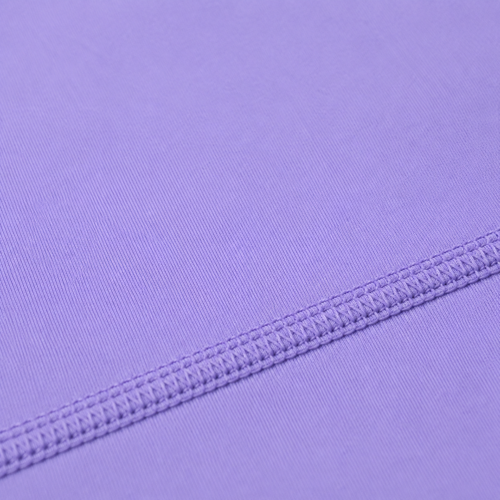 Close-up of the stitching and seam detail on the light purple Fitfigura Ace Motion Performance Set – Sculpt Match Form.