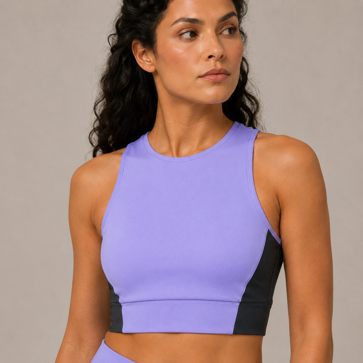 Close-up of the light purple Fitfigura Ace Motion Performance Set – Sculpt Match Form showing the sleeveless crop top, neckline, and smooth athletic fit.