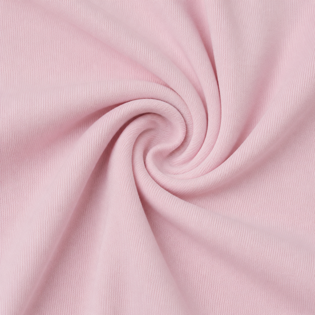 Close-up of the soft light pink fabric texture used in the Fitfigura Ace Skirt – Pleated Form.