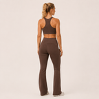 Back view of the brown Fitfigura Balance Flare Pant – Sculpt Silhouette, showing the fitted upper leg and flared lower silhouette.