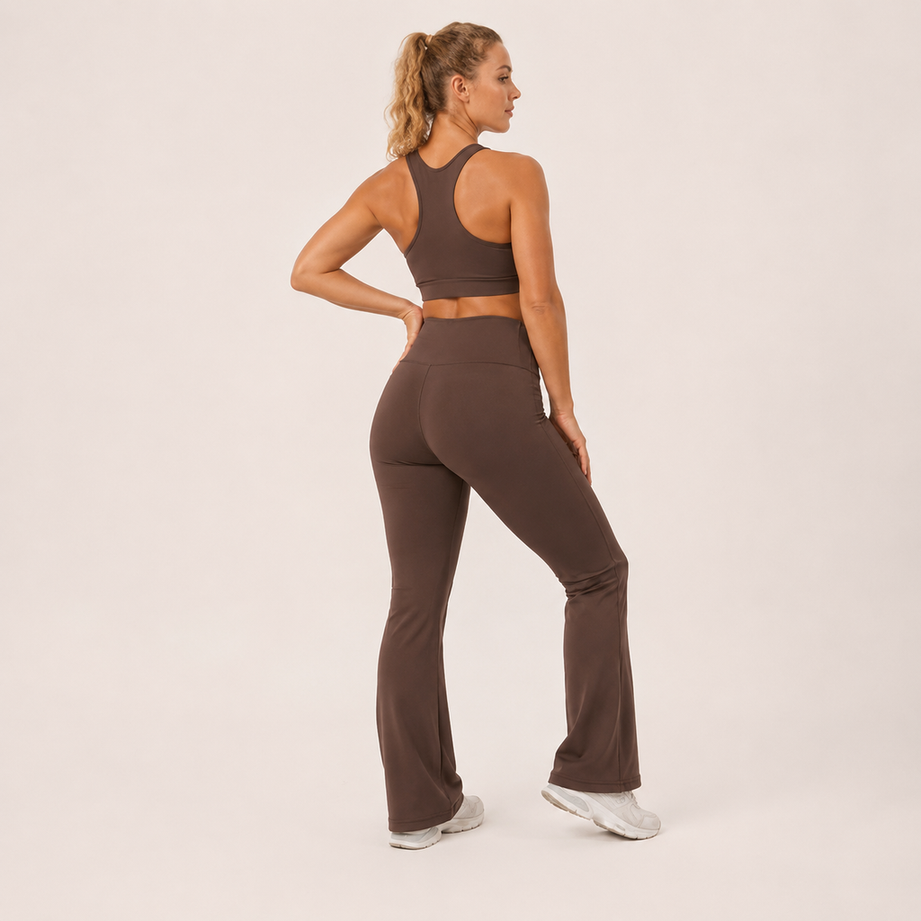 Three-quarter rear angle of the brown Fitfigura Balance Flare Pant – Sculpt Silhouette, highlighting the sculpted fit and flare.