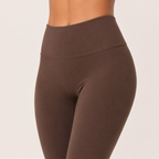 Close-up of the brown Fitfigura Balance Flare Pant – Sculpt Silhouette showing the high waistband and smooth contour fit.
