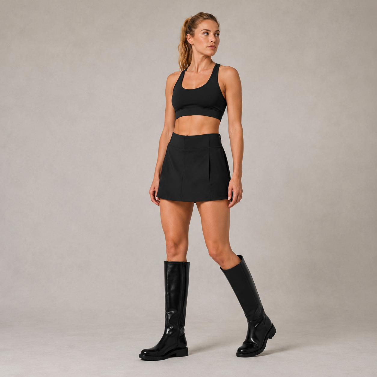 Angled studio view of the black Fitfigura Club Skirt – Luxe Resort Form, highlighting the sleek mini skirt silhouette and coordinated resort-style look.