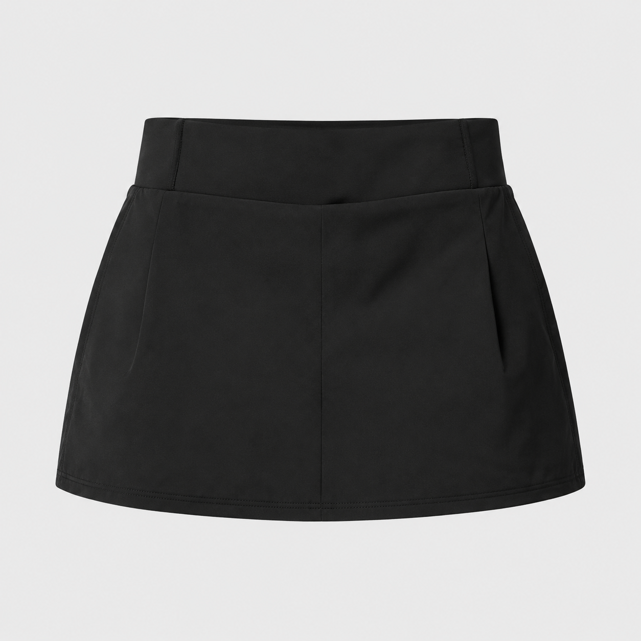 Flat lay of the Fitfigura Club Skirt – Luxe Resort Form in black, showing the skirt’s clean lines and compact resort-inspired silhouette.