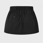 Product-only view of the black Fitfigura Club Skirt – Luxe Resort Form, showing the smooth waistband and structured mini skirt shape.