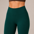 Close-up of the deep teal Fitfigura Core Compression Legging showing the high-rise waistband and sculpting compression fit.