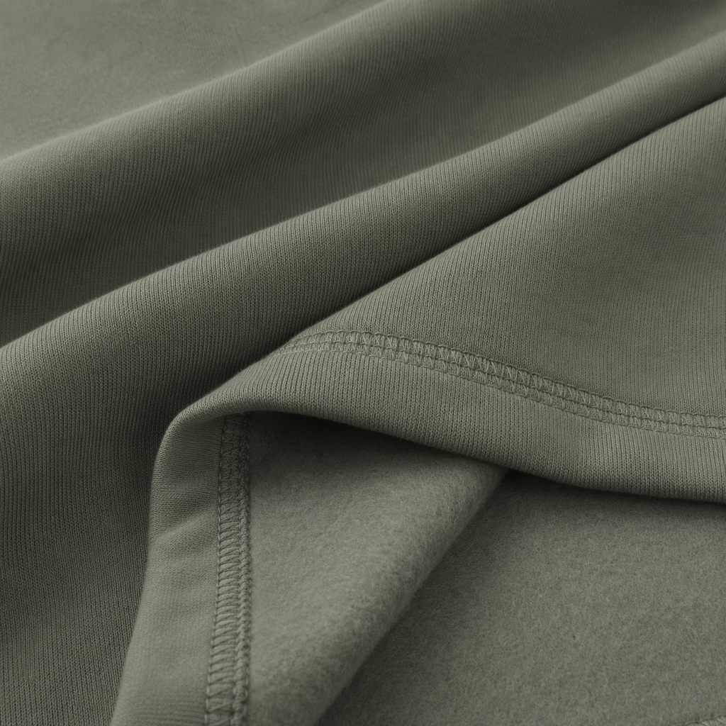 Close-up of the olive green fabric texture used in the Fitfigura Core Hoodie – Essential Form.