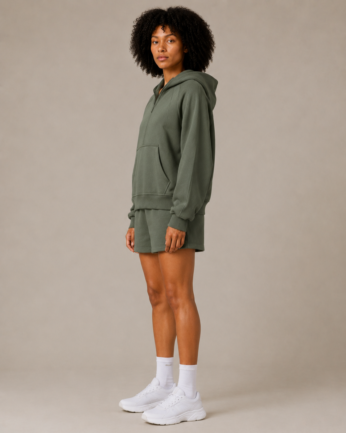 Side view of the Fitfigura Core Hoodie – Essential Form in olive green, showing the relaxed fit and casual activewear silhouette.