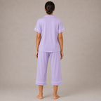 Back view of the light purple Fitfigura Core Loungewear Set – Essential Form, showing the relaxed short-sleeve top and matching pants.