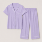 Flat lay of the Fitfigura Core Loungewear Set – Essential Form in light purple with a button-up short-sleeve top and matching pants.