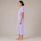 Side view of the Fitfigura Core Loungewear Set – Essential Form in light purple, showing the straight-leg pants and relaxed top silhouette.