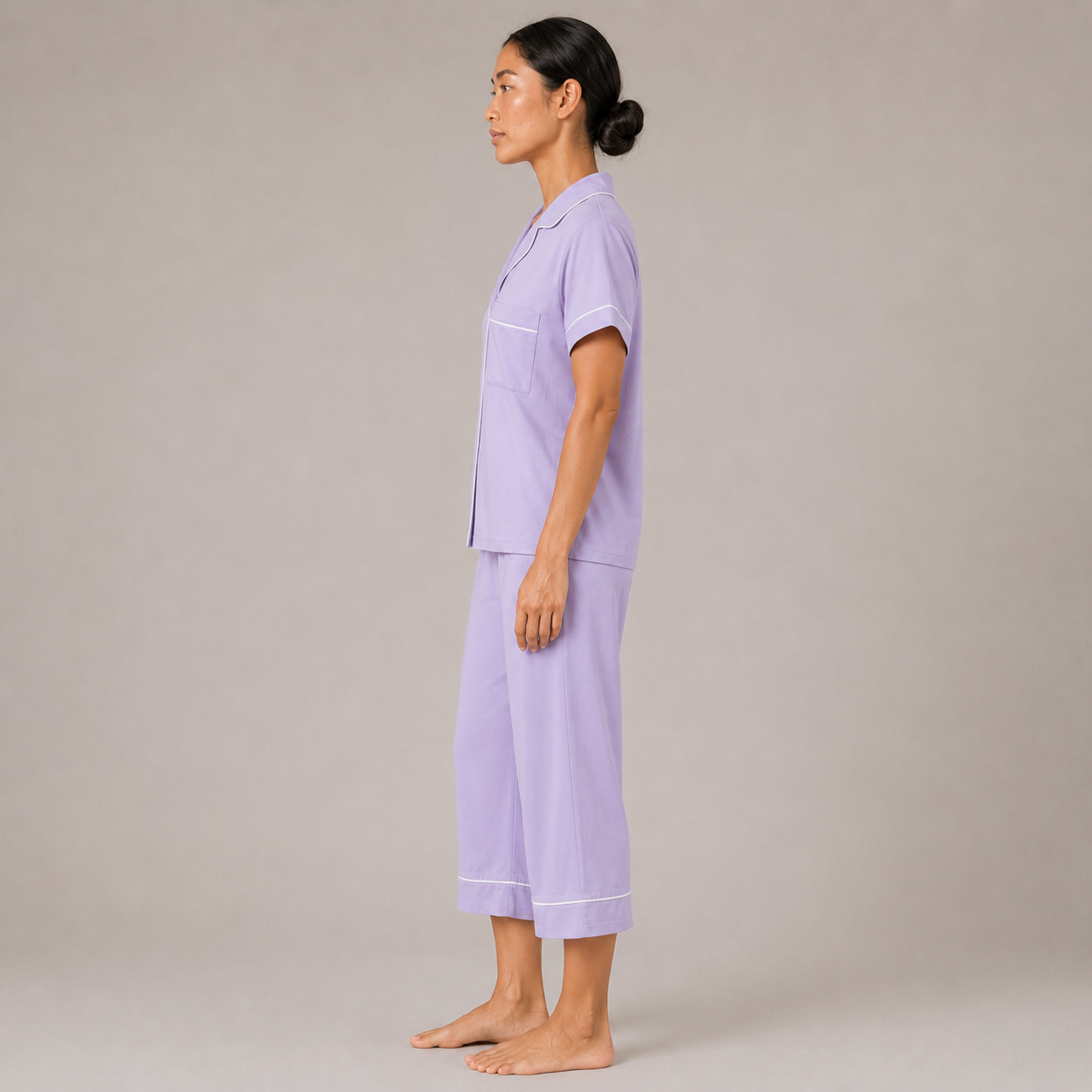 Side view of the Fitfigura Core Loungewear Set – Essential Form in light purple, showing the straight-leg pants and relaxed top silhouette.