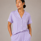 Close-up of the light purple Fitfigura Core Loungewear Set – Essential Form showing the collar, buttons, and soft neckline detail.