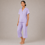 Model walking in the light purple Fitfigura Core Loungewear Set – Essential Form, highlighting the soft drape and relaxed lounge fit.