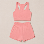 Flat lay of the Fitfigura Core Set – Minimal Sculpt Form in coral pink, featuring a sleeveless crop top and matching skirt.