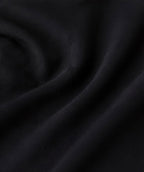 Close-up of the black fabric texture used in the Fitfigura Court Skirt – Classic Elite Form.