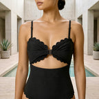 Close-up of the black Fitfigura Cutout One-Piece – Modern Edge Form showing the front cutout and gathered bust detail.