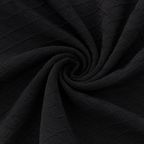 Close-up of the black textured fabric used in the Fitfigura Cutout One-Piece – Modern Edge Form.