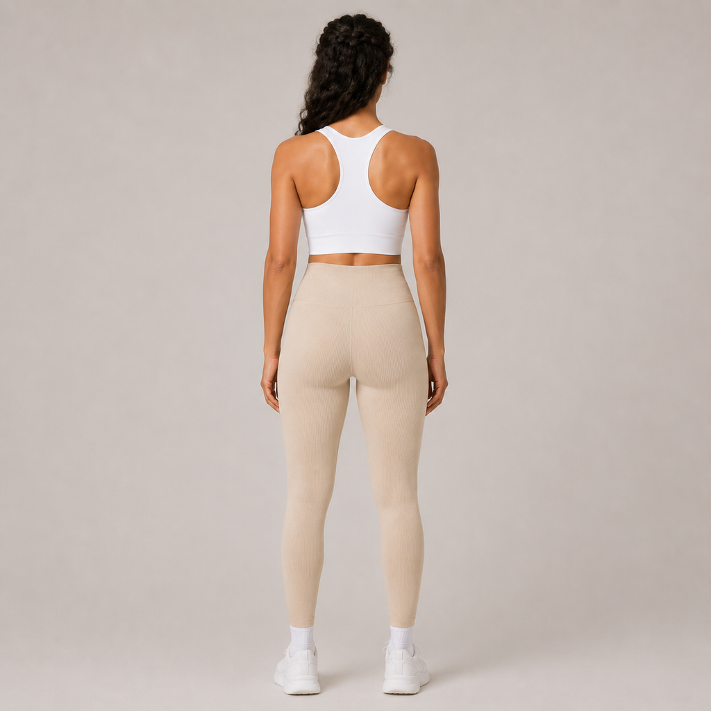 Back view of the cream Fitfigura Flex Rib Legging, showing the smooth rear fit and full-length leg design.