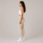 Side view of the Fitfigura Flex Rib Legging in cream, showing the high-waisted fit and full-length silhouette.