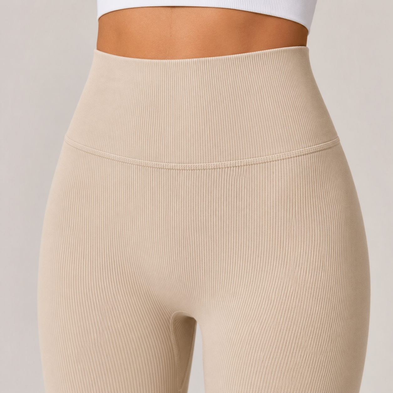Close-up of the cream Fitfigura Flex Rib Legging showing the ribbed high waistband and sculpting fit.