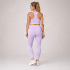 Back view of the light purple Fitfigura Flow Performing Set – Soft Movement Form, showing the rear fit of the crop top and leggings.