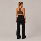 Back view of the black Fitfigura Lounge Flare Pant – Relaxed Luxury Form, showing the sculpted rear fit and full-length flared legs.