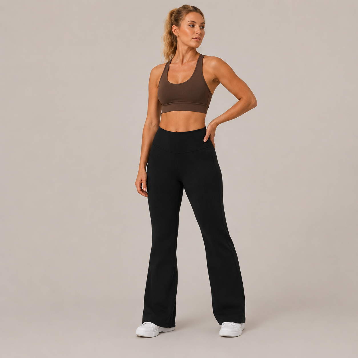 Model posing in the black Fitfigura Lounge Flare Pant – Relaxed Luxury Form, highlighting the high-rise waistband and smooth drape.