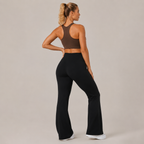 Three-quarter rear angle of the black Fitfigura Lounge Flare Pant – Relaxed Luxury Form, highlighting the contoured fit and flowing flare.