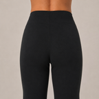 Close-up of the black Fitfigura Lounge Flare Pant – Relaxed Luxury Form showing the high waistband and smooth fitted upper silhouette.
