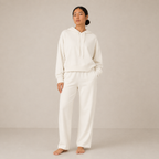 Model wearing the Fitfigura Lounge Oversized Hoodie – Soft Form in ivory with matching lounge pants, shown from the front.