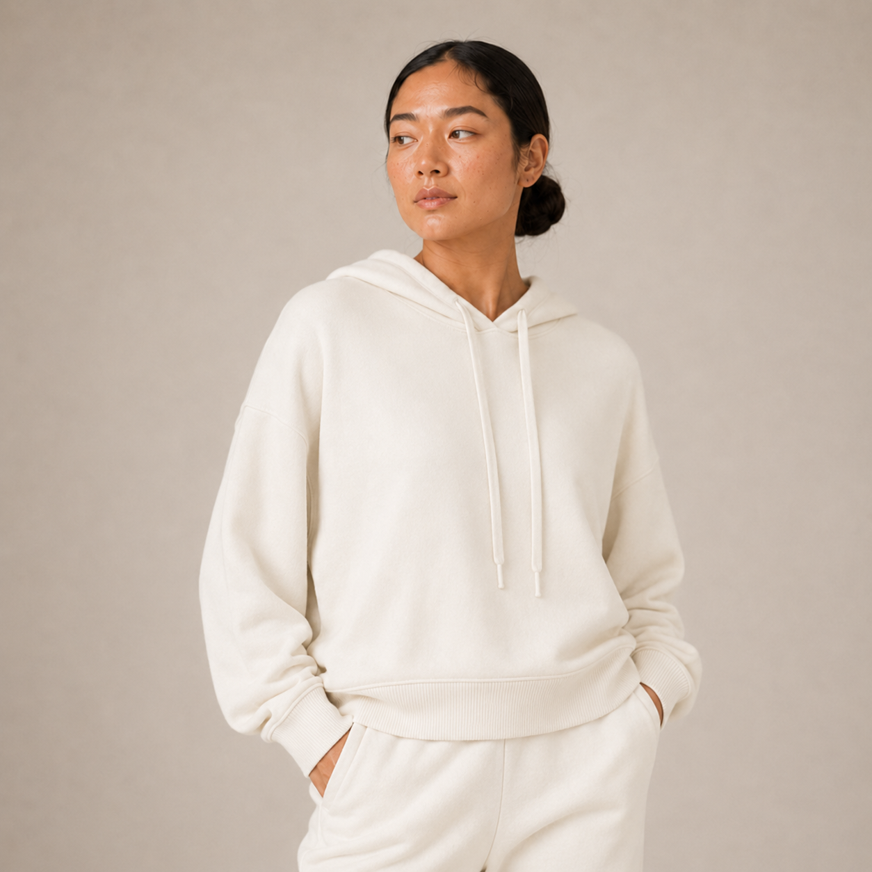 Close-up of the Fitfigura Lounge Oversized Hoodie – Soft Form showing the soft hood, relaxed sleeves, and front pocket styling.