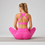 Back view of the hot pink Fitfigura LuxeSculpt™ Contour Legging Set showing the crisscross sports bra straps and high-rise leggings.