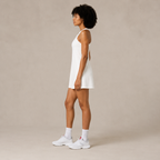 Side view of the Fitfigura Match Dress – Sculpt Motion Form in white, showing the smooth fit and straight dress shape.