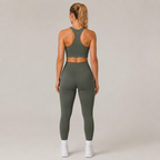 Back view of the Fitfigura Motion Bra – Sculpt Form in olive green, showing the racerback design and matching leggings.