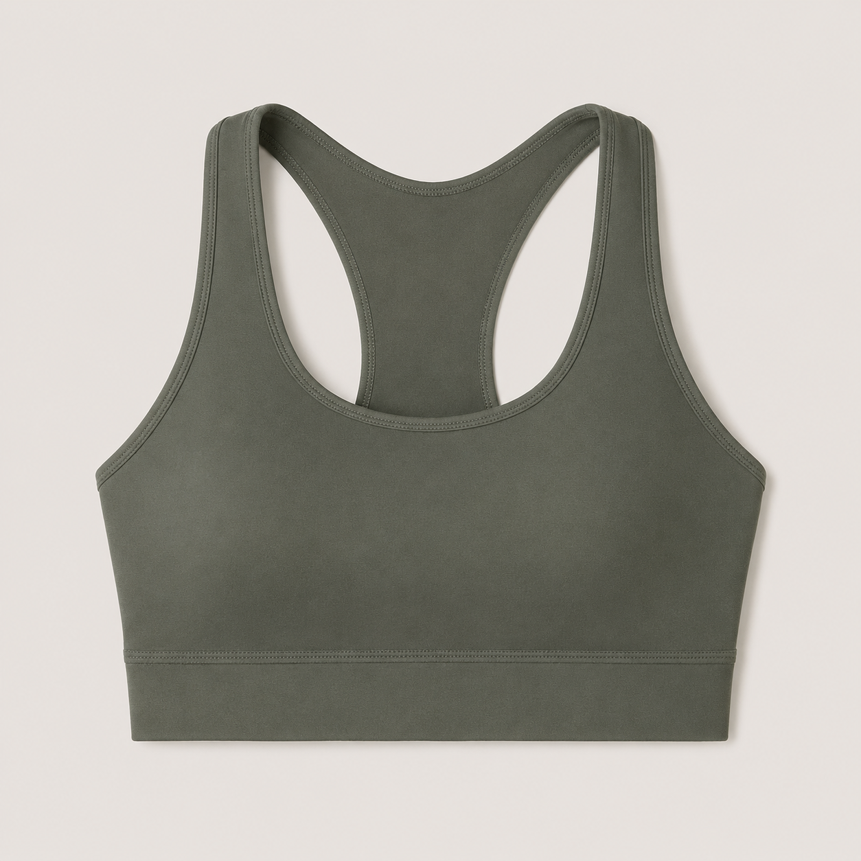Flat lay of the Fitfigura Motion Bra – Sculpt Form in olive green, showing the racerback shape, scoop neckline, and wide straps.