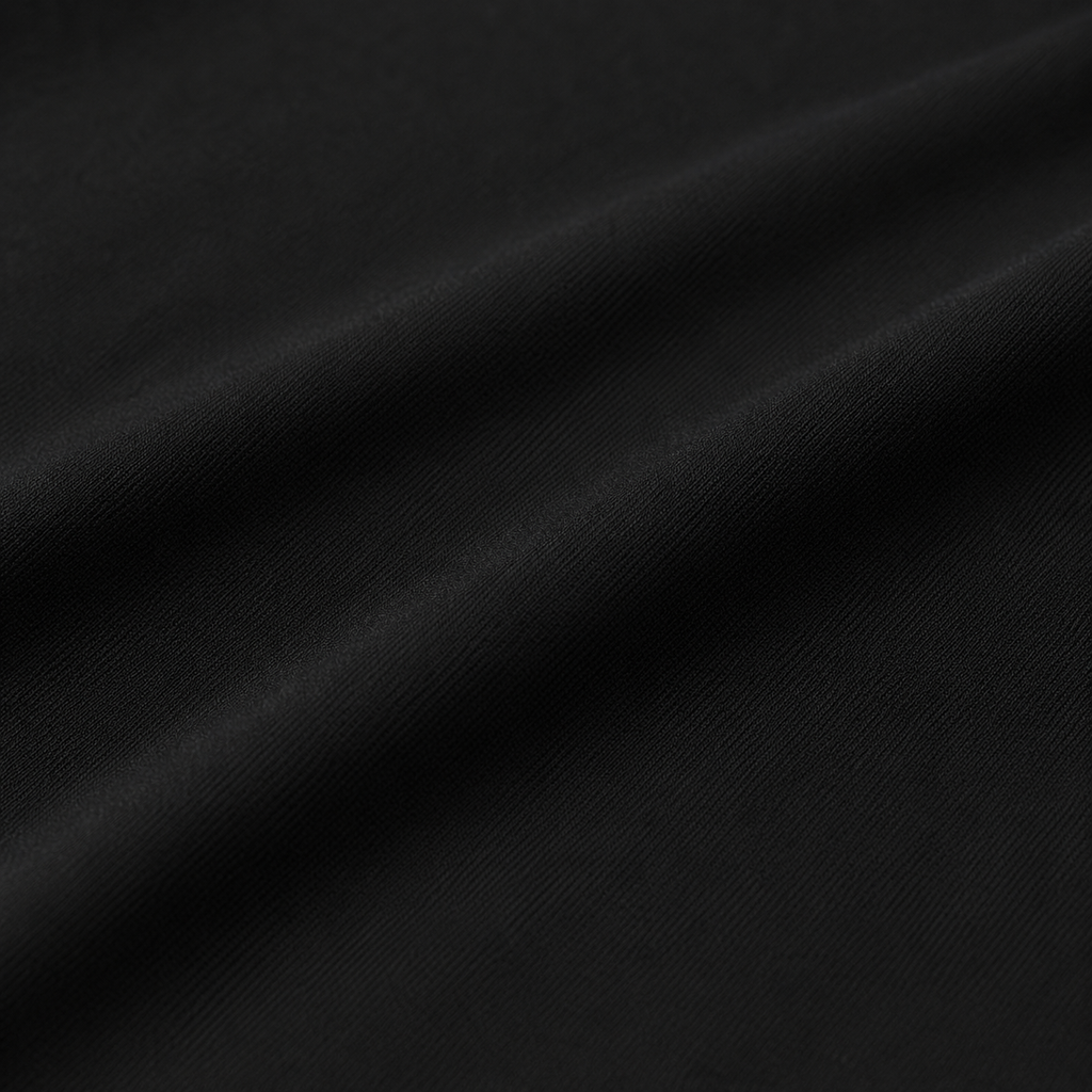 Close-up of the black fabric texture used in the Fitfigura Motion Skirt – Flow Court Form.