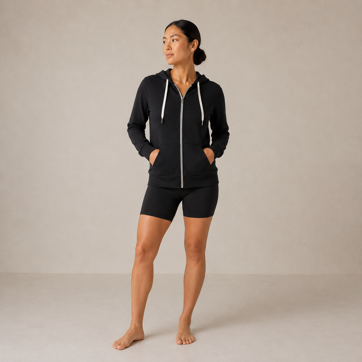 Model wearing the Fitfigura Performance Hoodie – Active Form in black with matching black shorts, shown from the front.
