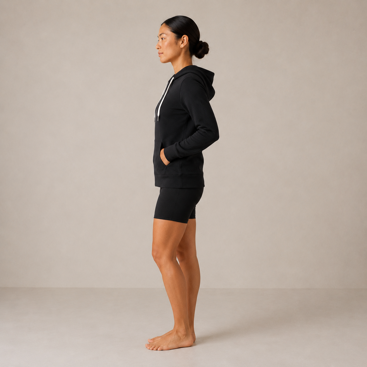 Side view of the black Fitfigura Performance Hoodie – Active Form, highlighting the relaxed fit and activewear silhouette.