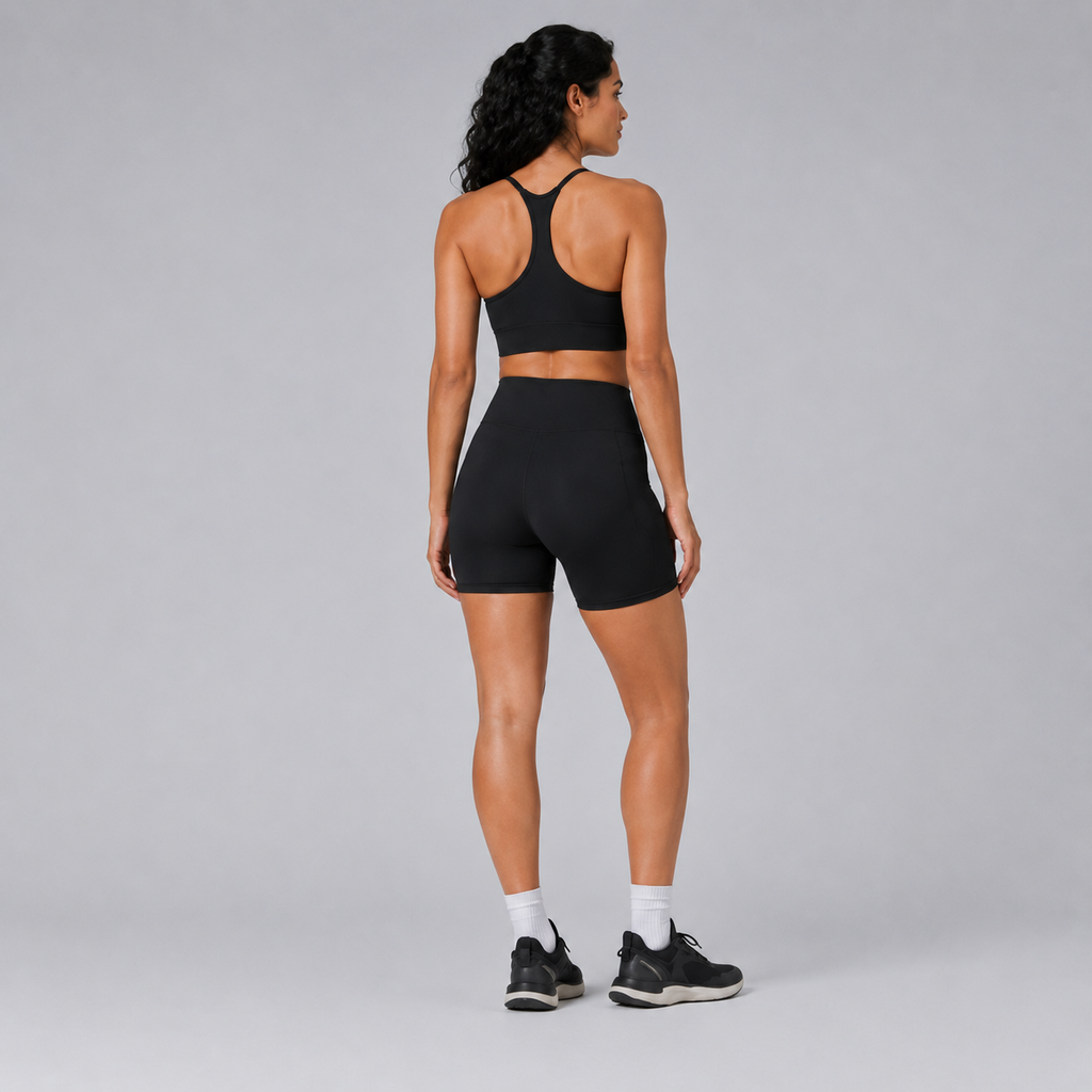 Back view of the black Fitfigura Pocket Short – Utility Performance Form, showing the high-rise waistband and smooth rear fit.