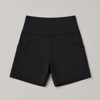 Flat lay of the Fitfigura Pocket Short – Utility Performance Form in black, showing the high waistband and fitted short shape.