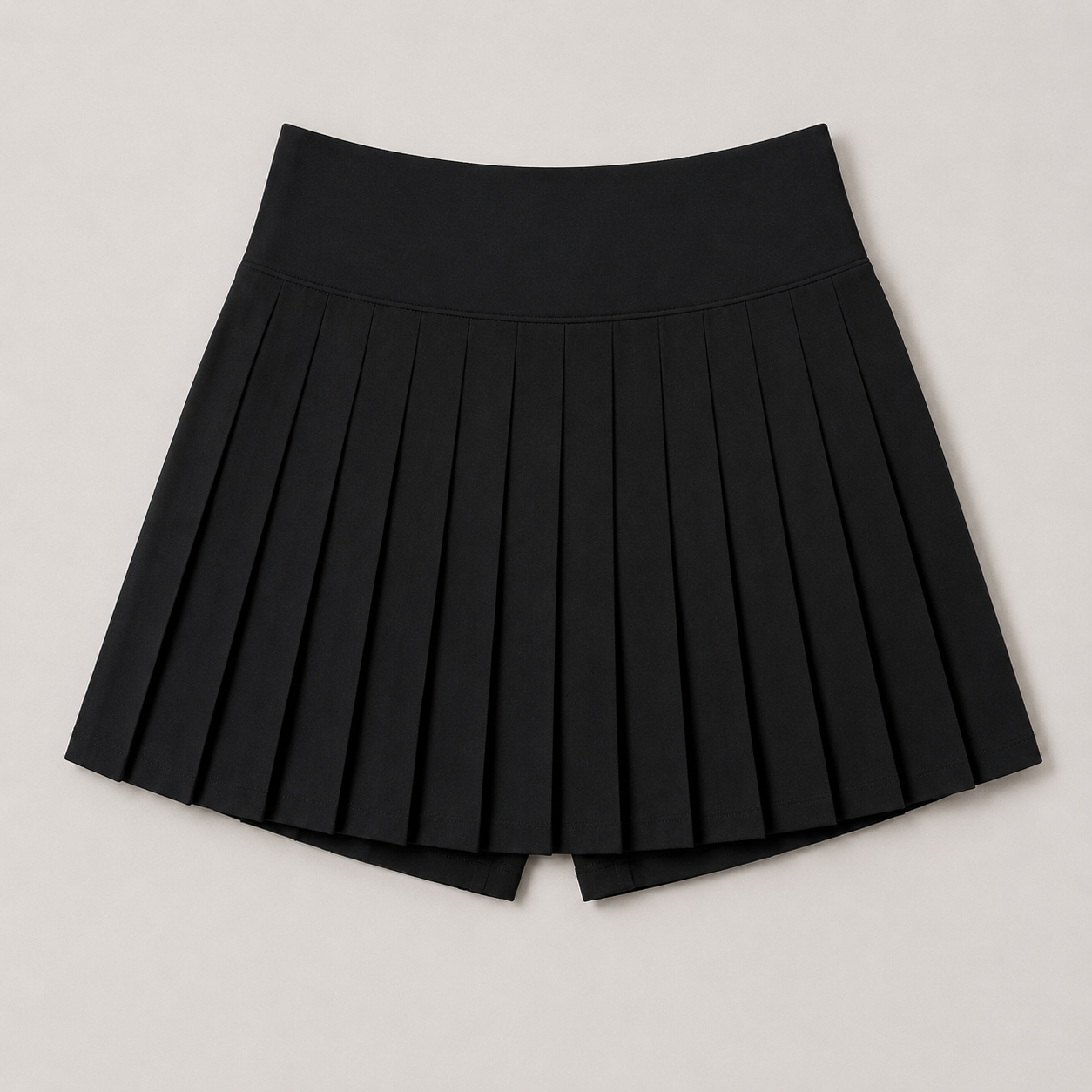 Flat lay of the Fitfigura Rally Tennis Skirt – Sculpt Court Form in black, showing the pleated design and structured shape.