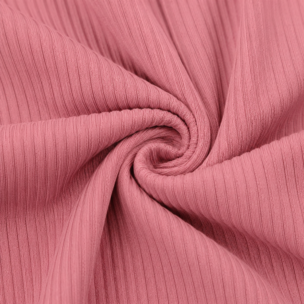 Close-up of the dusty pink rib knit fabric texture used in the Fitfigura Rib Knit Flare Pant – Textured Luxe Form.