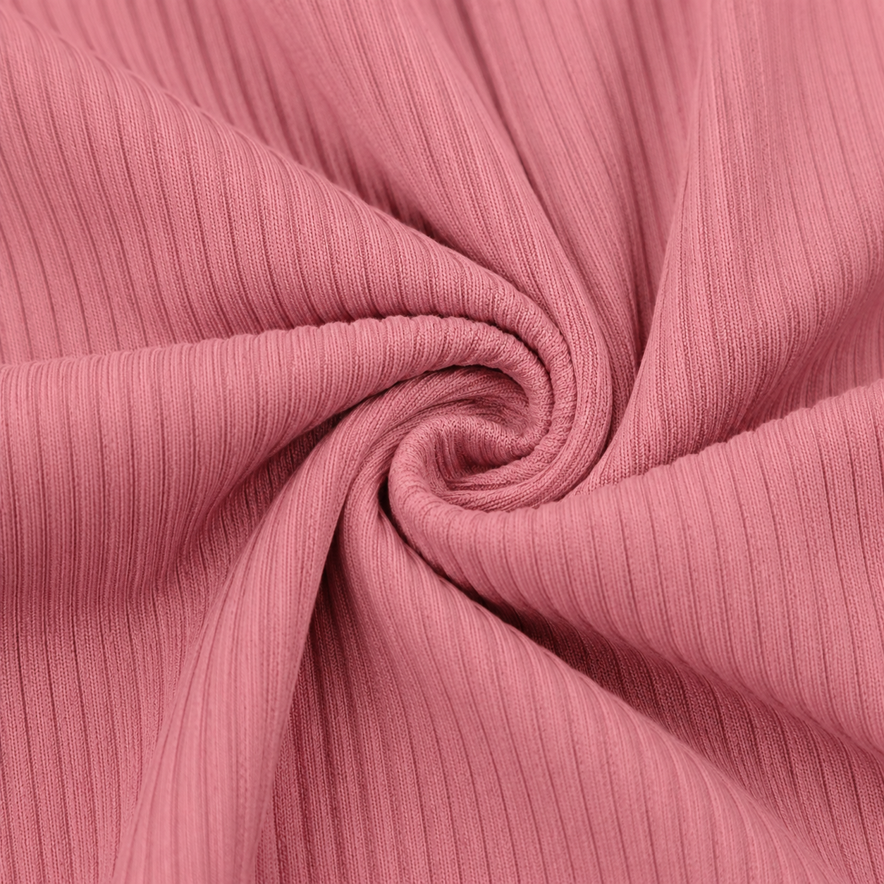 Close-up of the dusty pink rib knit fabric texture used in the Fitfigura Rib Knit Flare Pant – Textured Luxe Form.