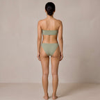 Back view of the sage green Fitfigura Sculpt Bikini – Contour Form, showing the back fit of the bandeau top and matching bikini bottoms.