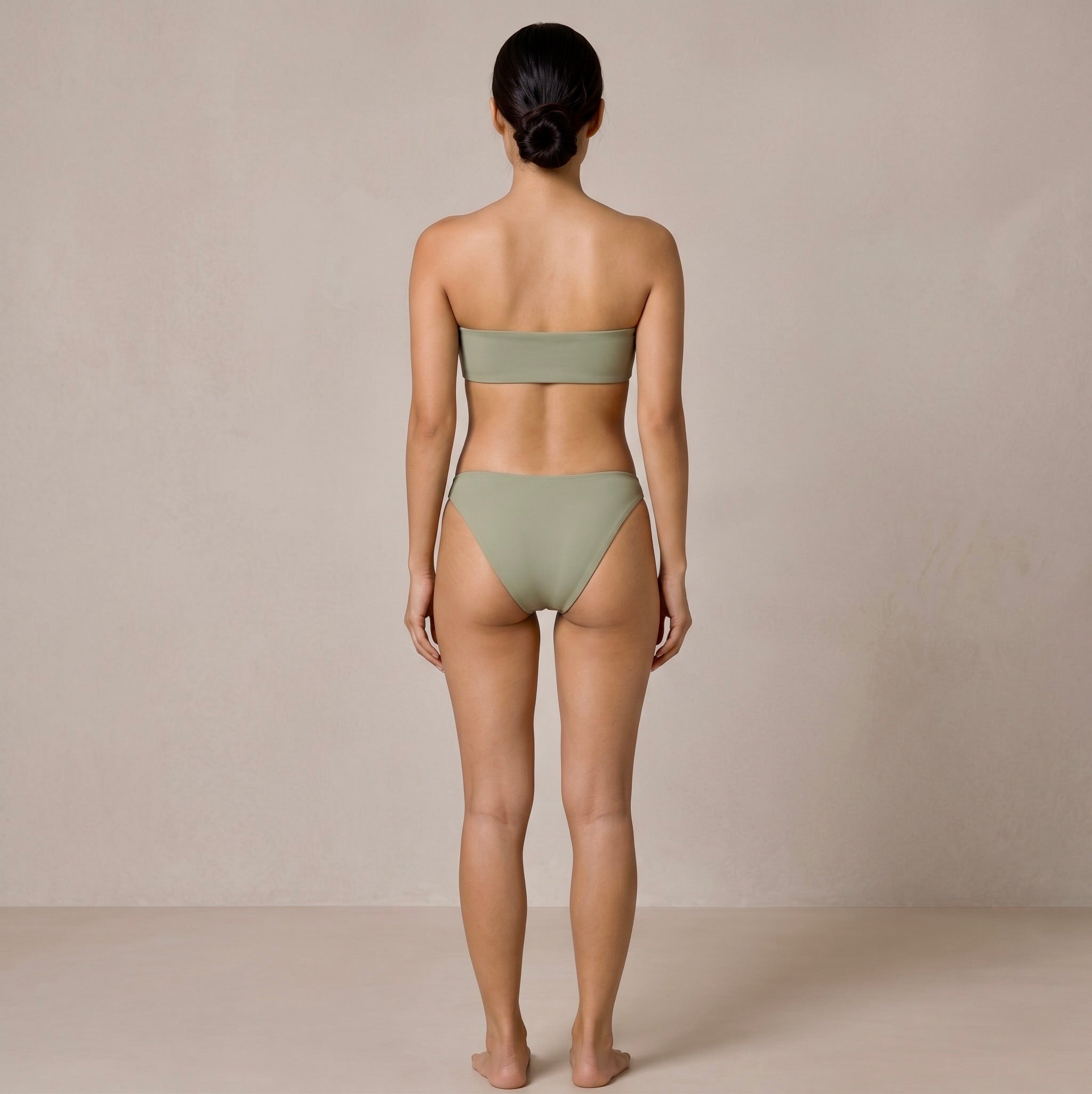 Back view of the sage green Fitfigura Sculpt Bikini – Contour Form, showing the back fit of the bandeau top and matching bikini bottoms.